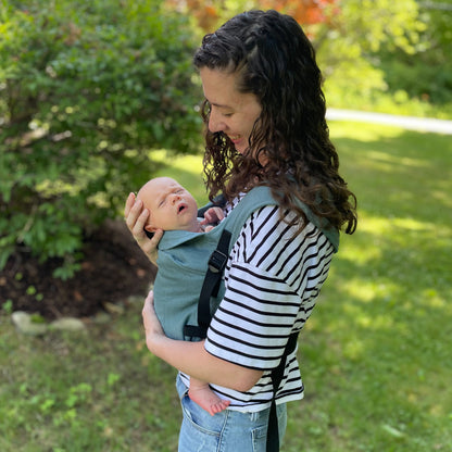 Elisha is with Michael, 5 weeks old, wearing size 0-3m clothes